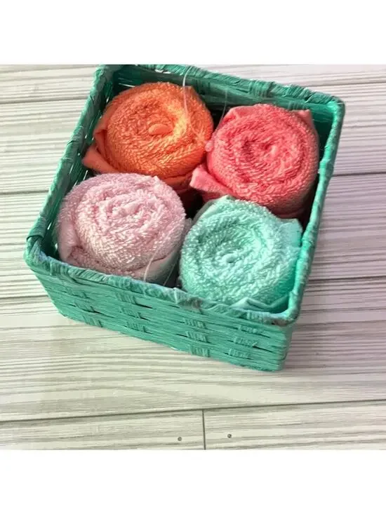 Colorful Rolled Wash Cloths in Basket