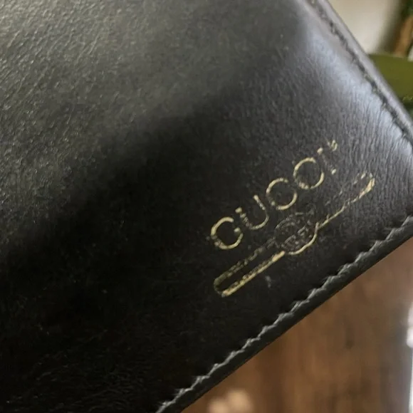Gucci Mens Bi Fold Black Leather Gold Print Logo Wallet Discoloration the log
