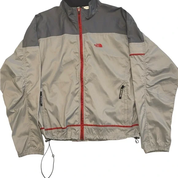 The North Face Men's Gray Windbreaker with Red Accents Size M.