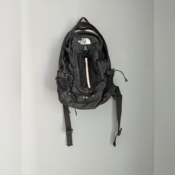 The North Face Black Amira Backpack With Adjustable Chest And Waist Straps.