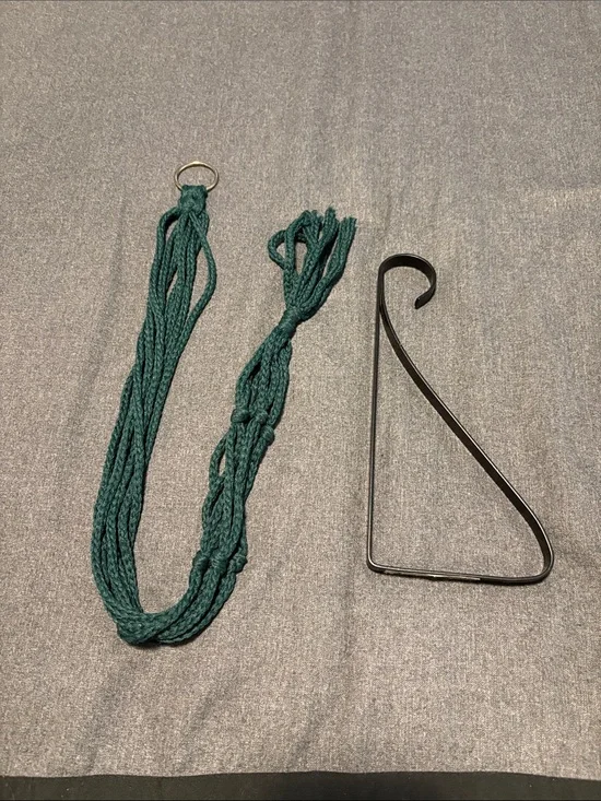 Vintage Boho Green Macrame Plant Hanger and black metal wall plant hanger.