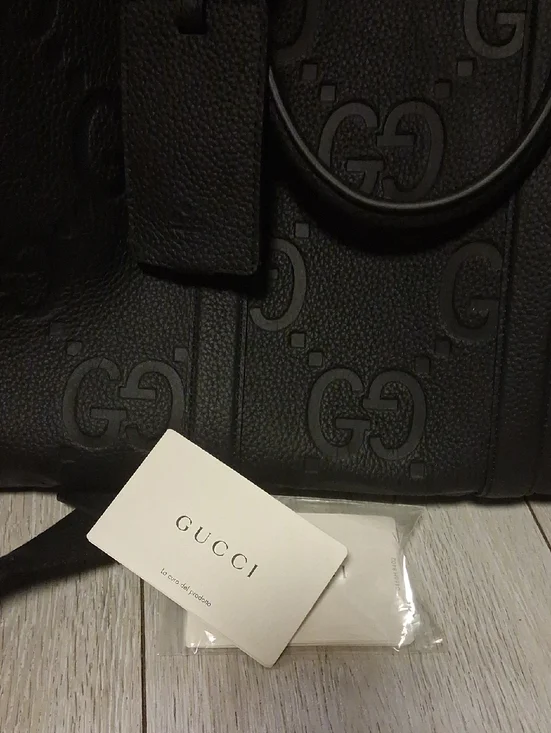 i Black Embossed Leather Travel Duffle