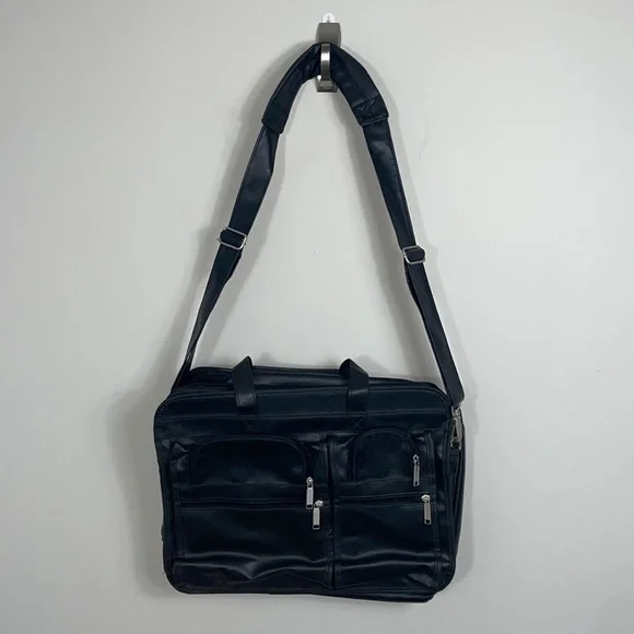 Soft bodied faux leather briefcase lots of pockets and crossbody strap
