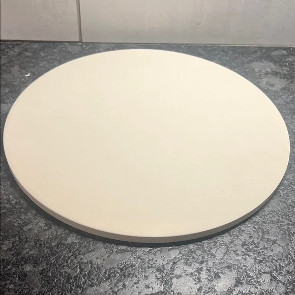 11.5” Round Cream Pizza Stone. New in box. No brand noted on it
