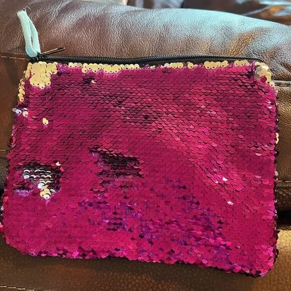 Claire’s color change sequin clutch or cosmetics bag