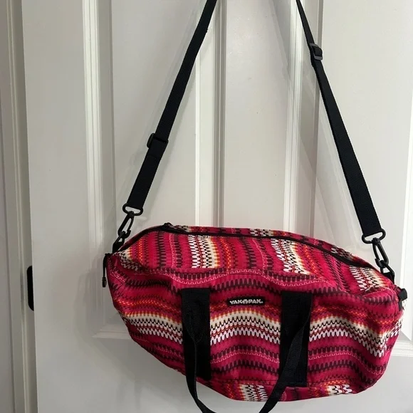 Like new YakPak duffle bag. Pink colorful zigzag design with black details