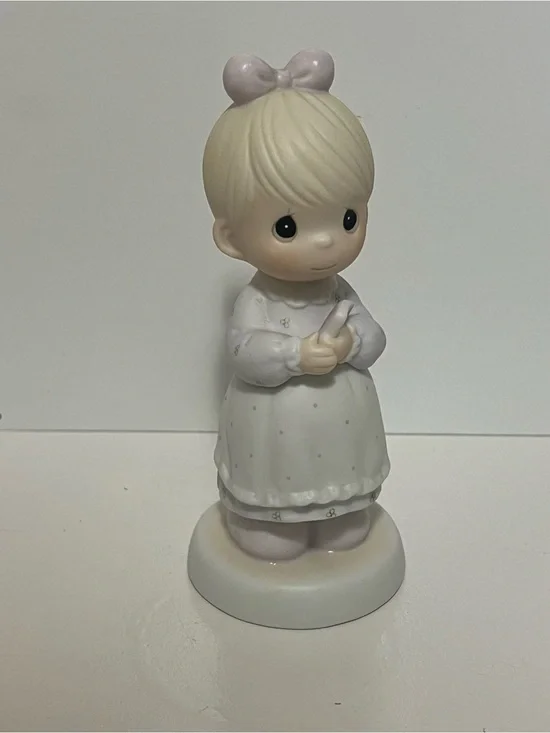 Precious Moments figurine “The Good Lord Always Delivers” from 1989