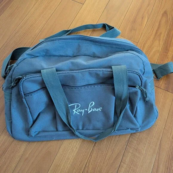 USED medium size duffle bag w/Ray Ban embroidered logo & never hide screen print