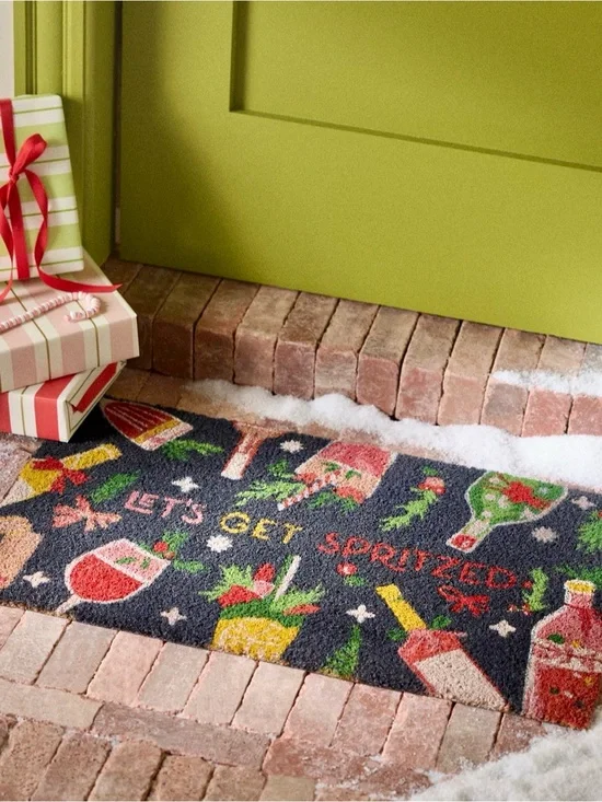 Anthropologie Let's Get Spritzed Coir Printed Doormat playful holiday pattern