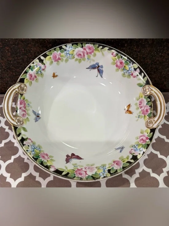 Nippon Hand-painted bowl featuring a floral motif & butterflies with gold trim