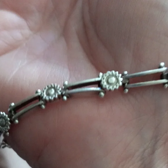 Elegant Silver Bracelet with Floral Accents