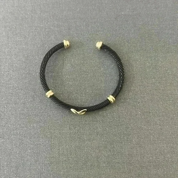 Black enamel bracelet with gold detail