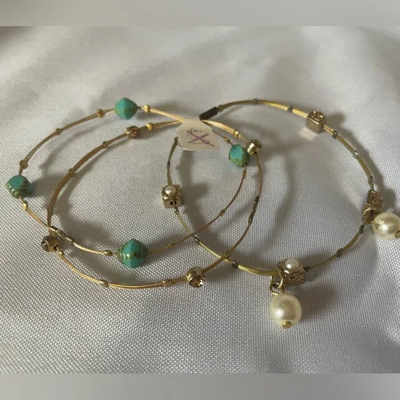 Set of three delicate bracelets