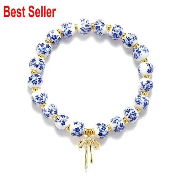 Handmade Stretch Beaded Bracelet with Gold Plated Bow Charm