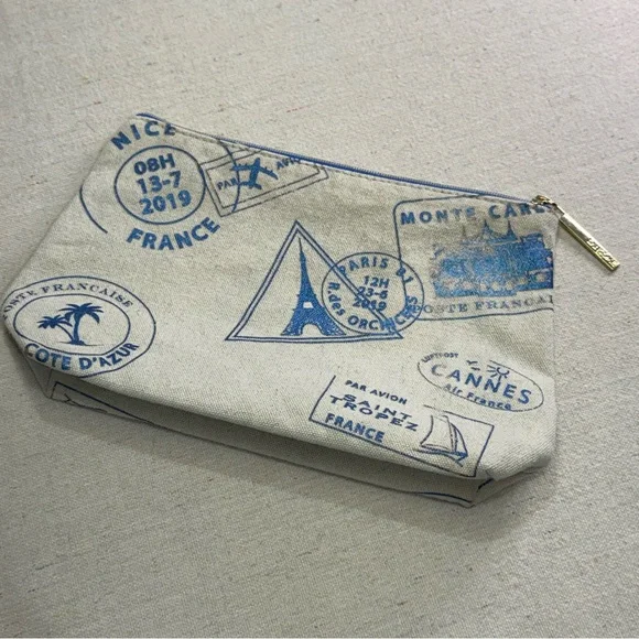 Lancôme Paris canvas cosmetic bag - blue passport stamp design
