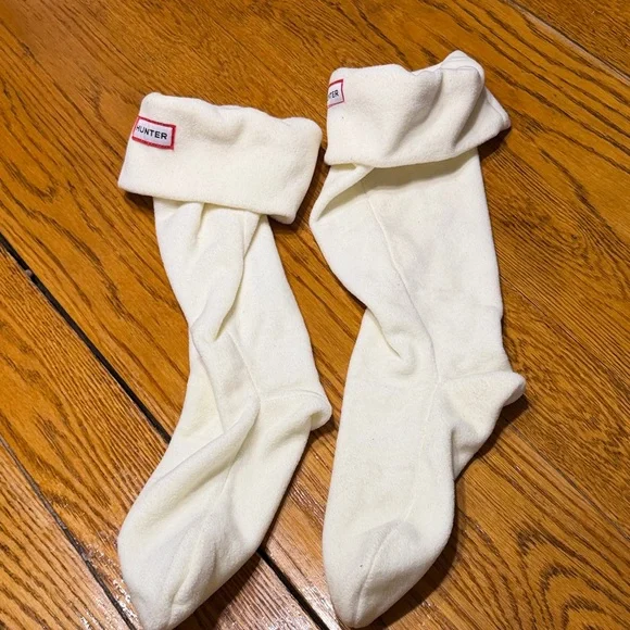 Hunter brand boot socks inserts.  Cream color with logo on front.