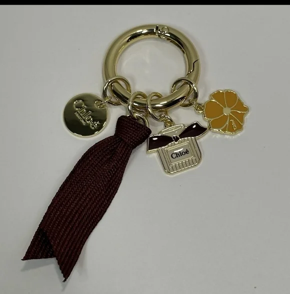 Chloé Gold-Tone Keyring with Burgundy Ribbon and Yellow Enamel Flower