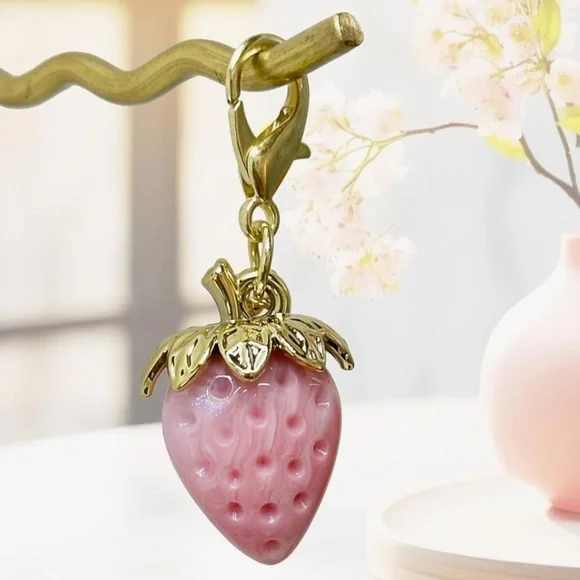 Pink strawberry purse charm with gold hardware