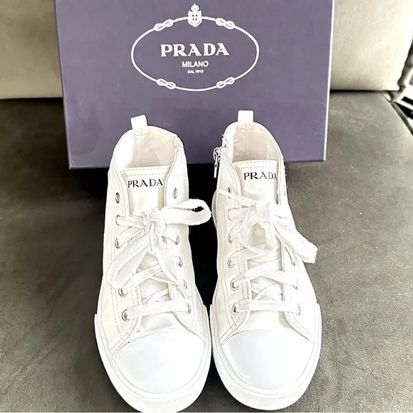 PRADA all white leather high top sneakers size 34 with original box on real real