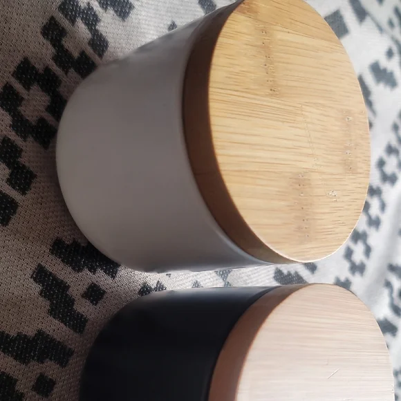 White and Black Ceramic Jars with Wooden Lids