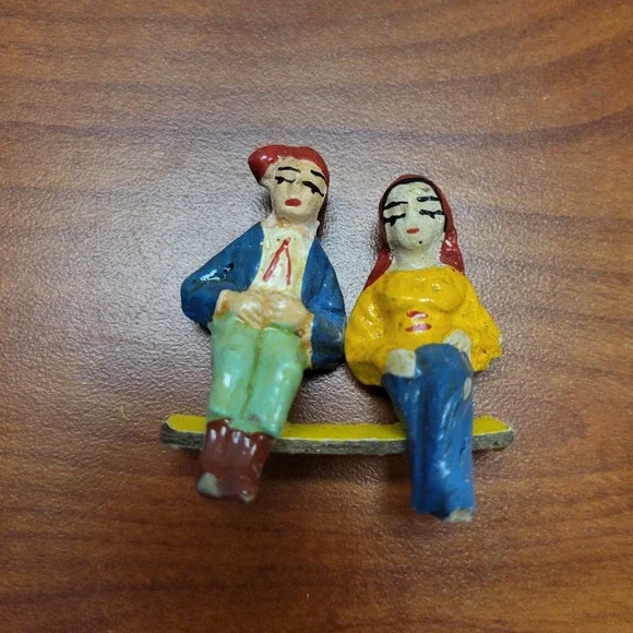 Cast Iron Vintage Hand‎ painted man & woman shelf sitters