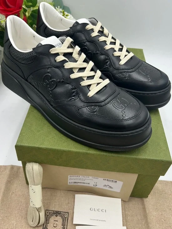 Men’s Gucci GG embossed black leather sneakers.Size11 (fits 11.5.) Made in Italy
