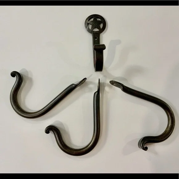 FOUR hand‎ forged iron hooks.