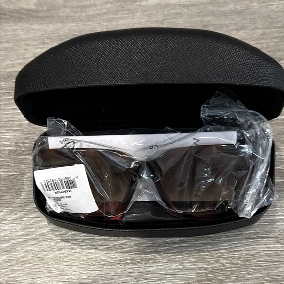 Salvatore Ferragamo Tortoise Sunglasses with SF Logo at Temples.