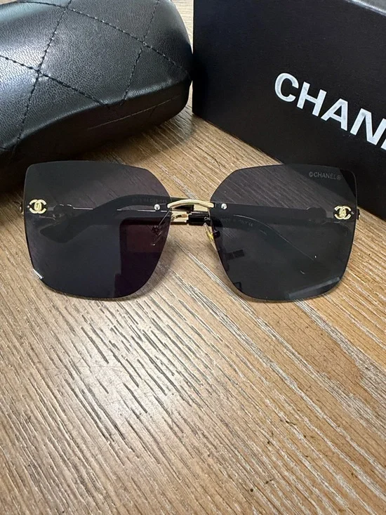 Chanel Women's Black and Gold Rimless Square Sunglasses