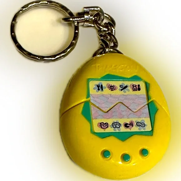 VTG 1997 TAMAGOTCHI YELLOW KEYCHAIN DIGITAL PET EGG GAME MCDONALDS YELLOW EASTER