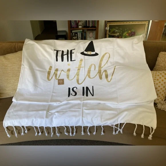 “The Witch Is In” by mudpie White Throw Blanket