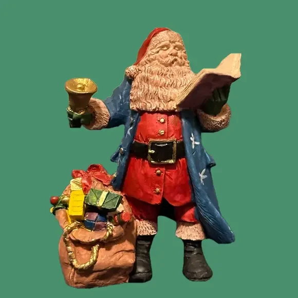 Gorgeous blue robed Santa rings a bell and reads to the crowds!