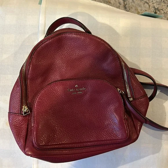 Kate, spade wine colored back pack in pebbled grain leather Beautiful lining