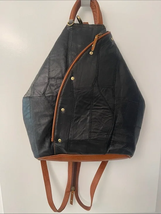 Black Leather Backpack with Brown Trim and Brass Accents