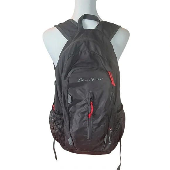 EDDIE BAUER STOWAWAY PACKABLE 20L BACKPACK in black with red piping