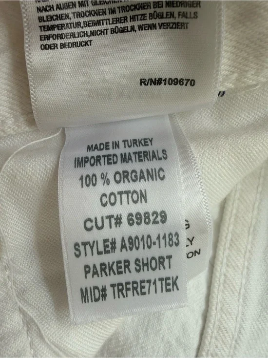AGOLDE White High-Rise Button-Fly Denim Shorts. (Parker long). Panna cotta