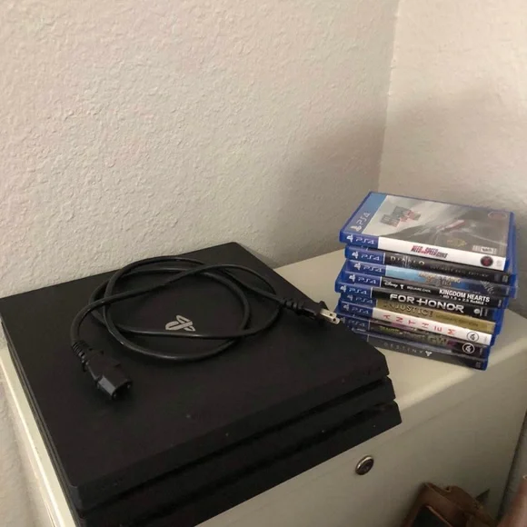 PS4 PlayStation 4 Pro CUH-7115B 1TB + 9 Games + Power Cord Bundle