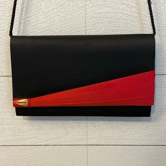 Black and red retro 80's or 90's vintage women's purse with magnetic clasp party