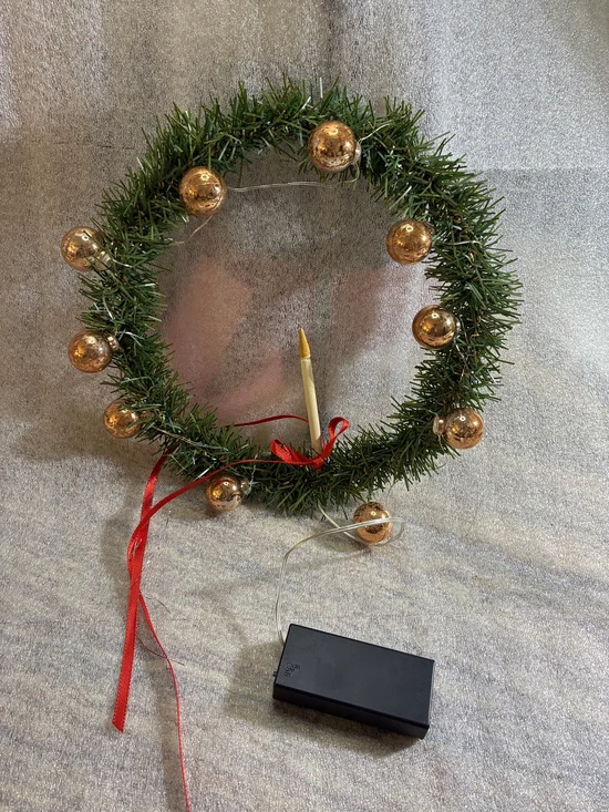 Holiday Green Wreath with Gold Ornaments and Candle
