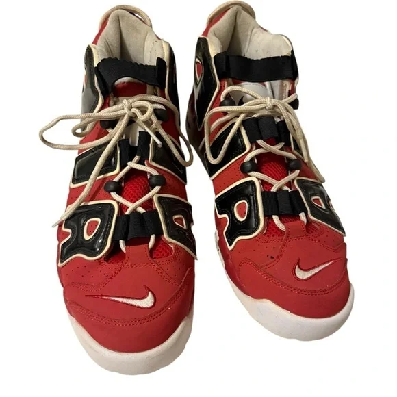This is a pair of Nike Air More Uptempo '96 basketball shoes in a red, black.