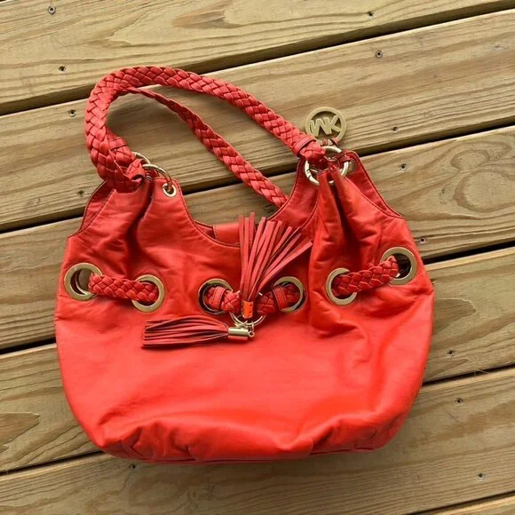 Michael Kors orange leather tassel hobo bag purse braided
