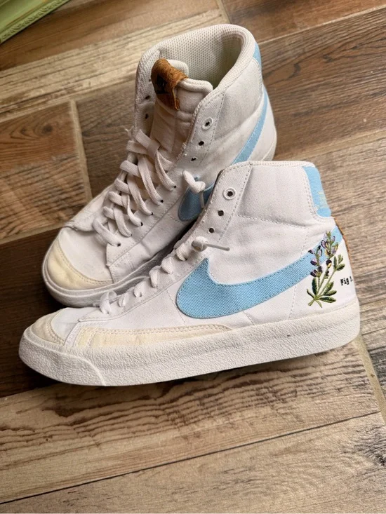 Nike White High-Top Sneakers with Light Blue Swoosh and Floral Detail