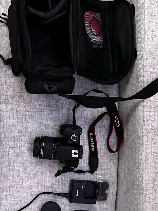 Canon DSLR Camera with Black Body and Red-Trim Strap