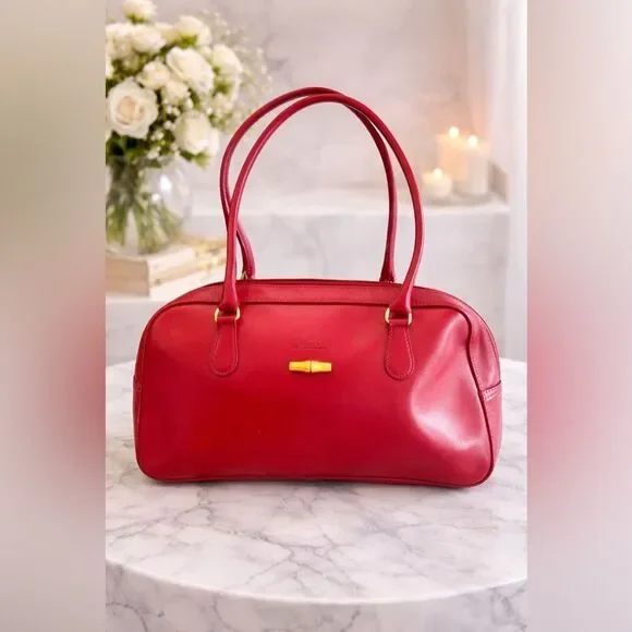 Vintage Longchamp Roseau Leather Bag in the color Bordeaux.