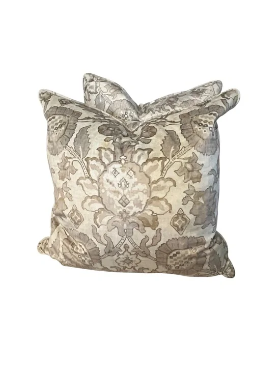 Decorative throw pillow showcasing a floral damask pattern in neutral tones