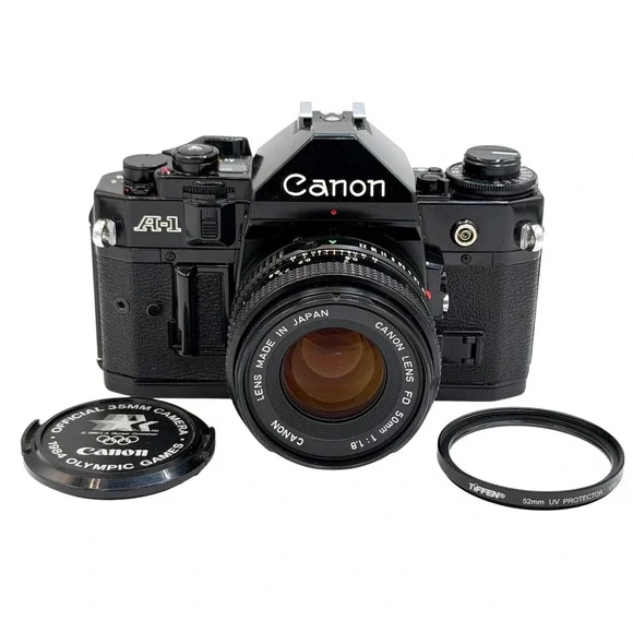 Canon A-1 35mm Film SLR Camera with FD 50mm 1:1.8 Lens, Filter, Cap Black TESTED
