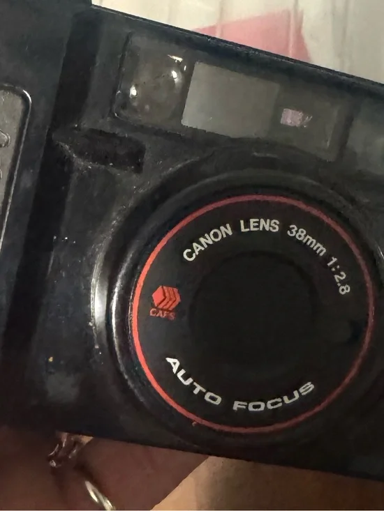 Canon Black Camera with Red Accent 38mm Auto Focus Lens