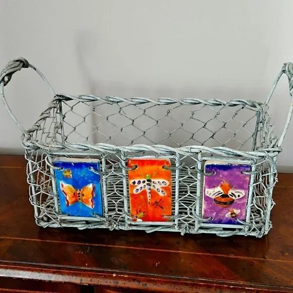 Vintage basket decorated with ceramic tiles