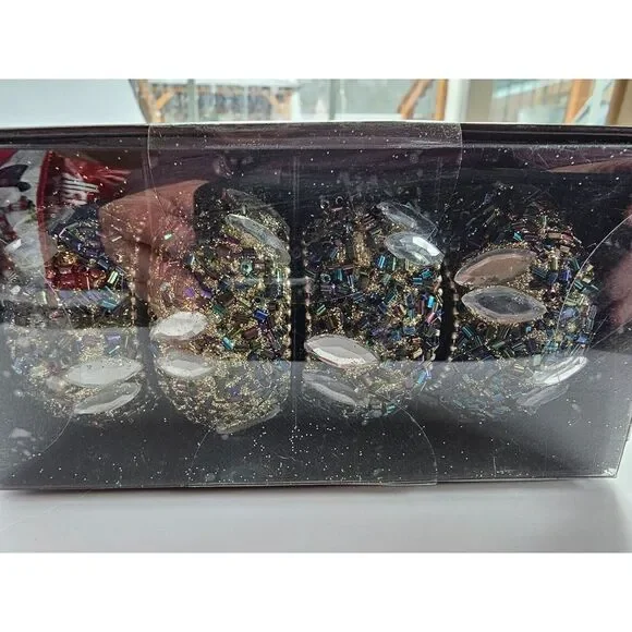 New 4 piece Napkin ring holders in gold and black beads