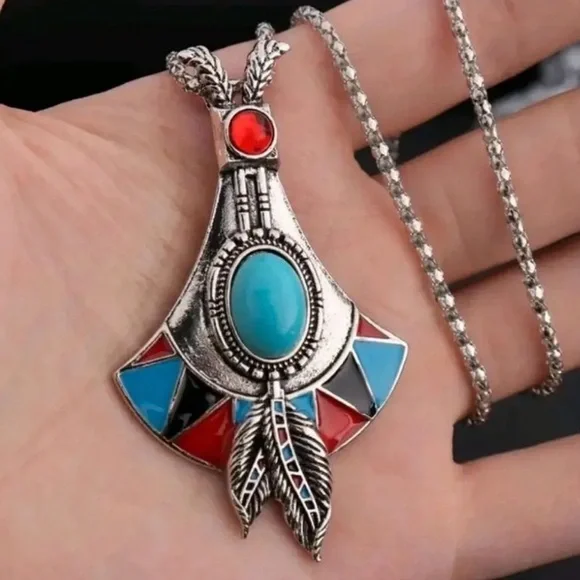 Bohemian Silver Pendant Necklace with Turquoise and Red Accents.